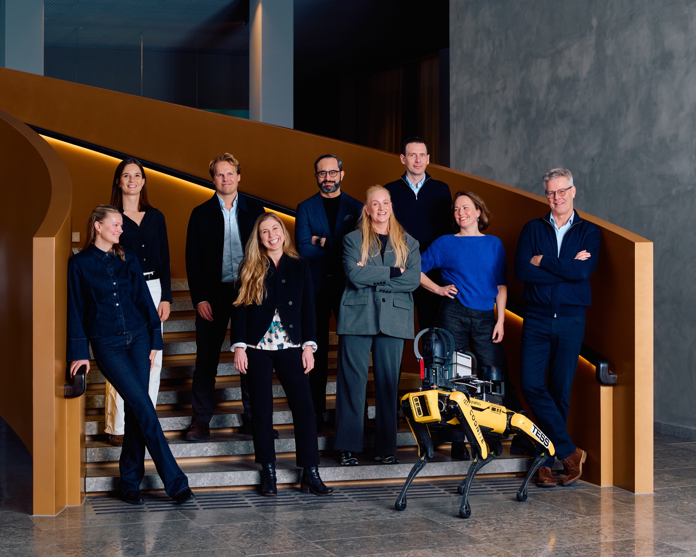 The RunwayFBU team with a Boston Dynamics Spot robot on the staircase at Fornebu